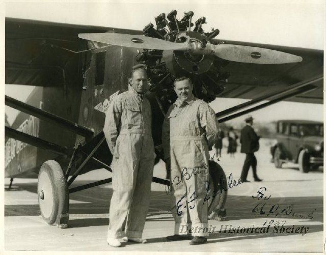Two pilots in front of a Stinson Detroiter, 1927 - 1950.164.132