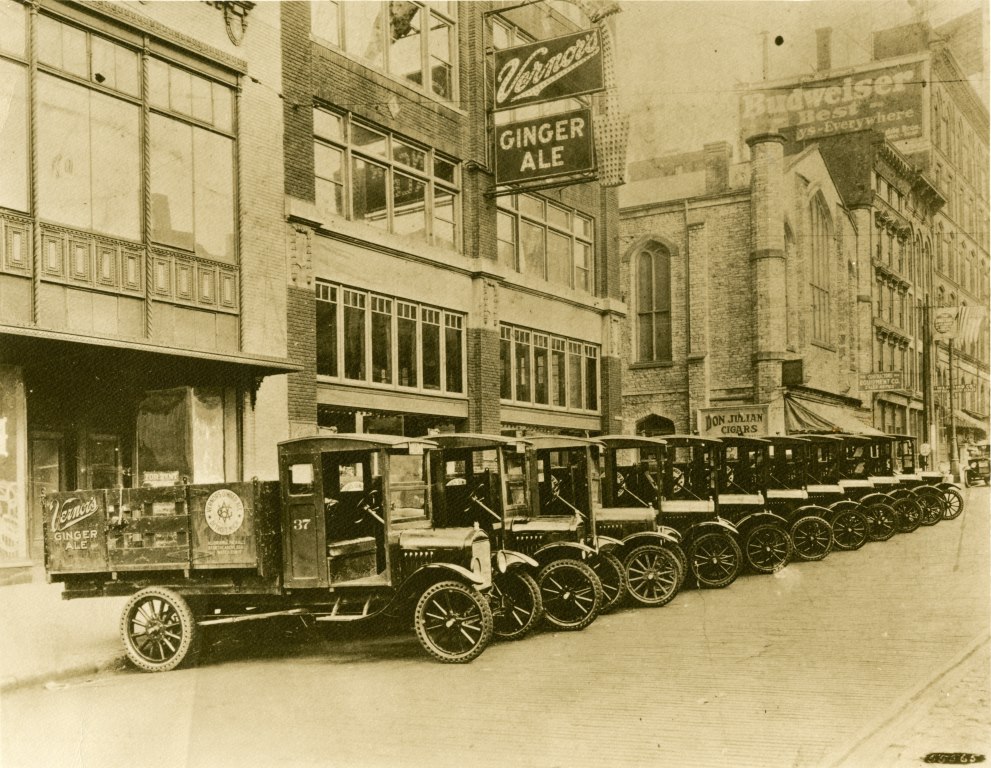 Delivery trucks in front of bottling plant on Woodward Ave, c. 1920