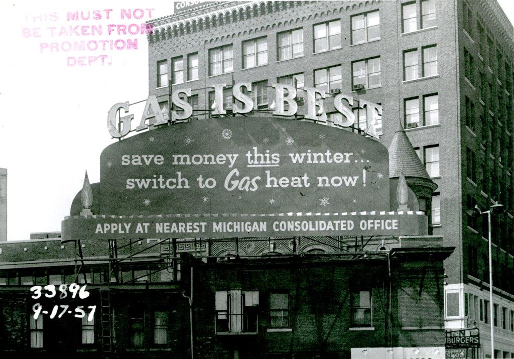 1957, ornate cornice of the Michigan Consolidated Gas Co. Building in the background.