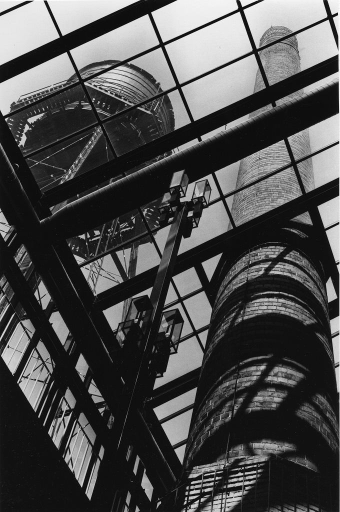 Preserved water tower and smokestack seen through the sky-roof (Carmen Truice, 1982).