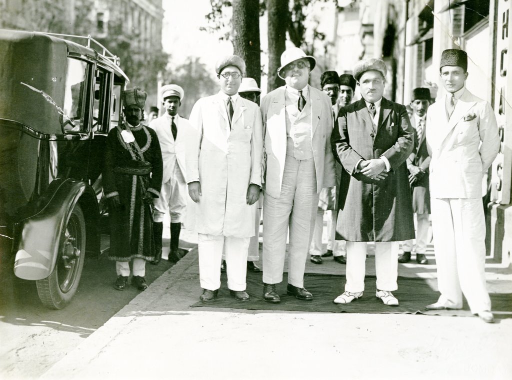 From left to right: Y.C. Mitha, the Aga Khan III, H.C. Mitha, and A. Rahimtulla