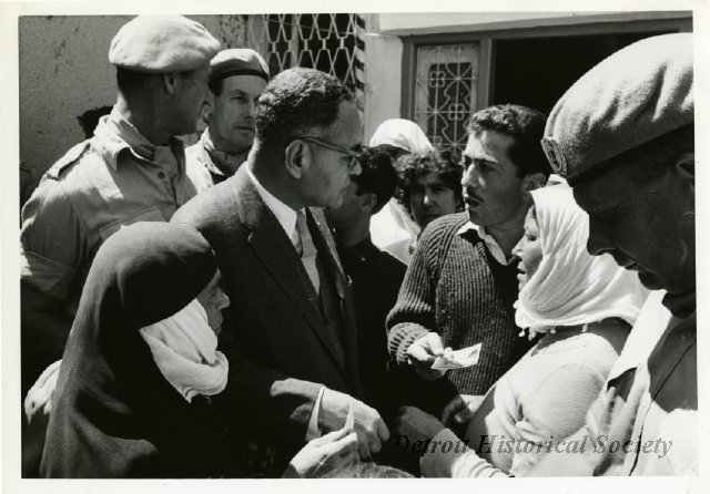 Under-Secretary Bunche and several members of the United Nations Peace-Keeping Force in Cyprus meet with residents of Ktima on April 9, 1964.