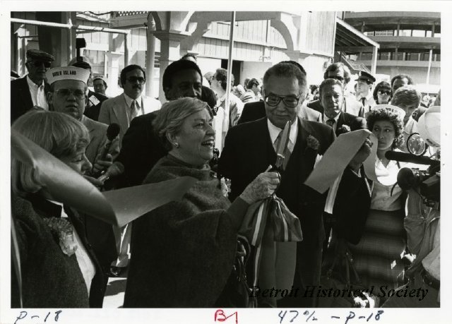 Coleman A. Young holding the tape at the reopening of Boblo Island, 1983 - 2012.022.200